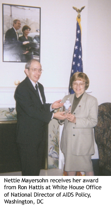 Nettie Mayersohn receives her award from Ron Hattis at White House Office of National Director of AIDS Policy, Washington, DC