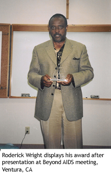 Roderick Wright displays his award after presentation at Beyond AIDS meeting, Ventura, CA